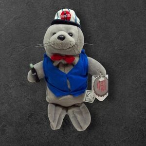 Coca-Cola Seal Plush with Blue Vest and Red Bow Beanie 1998